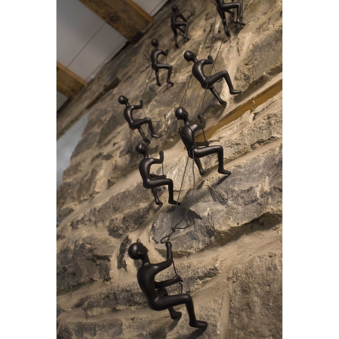 Set of Four Black Resin Climbing Man Wall Sculptures