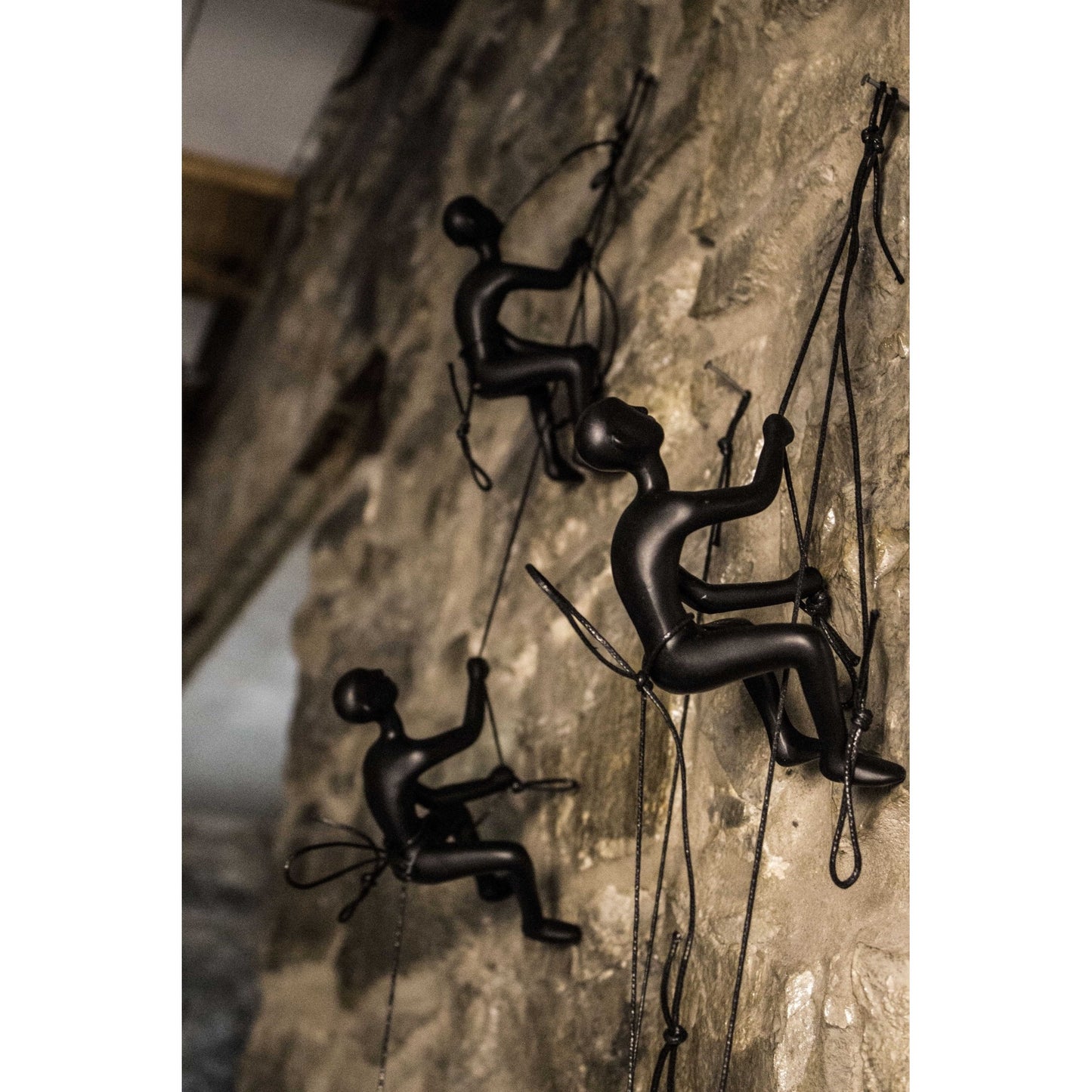 Set of Four Black Resin Climbing Man Wall Sculptures