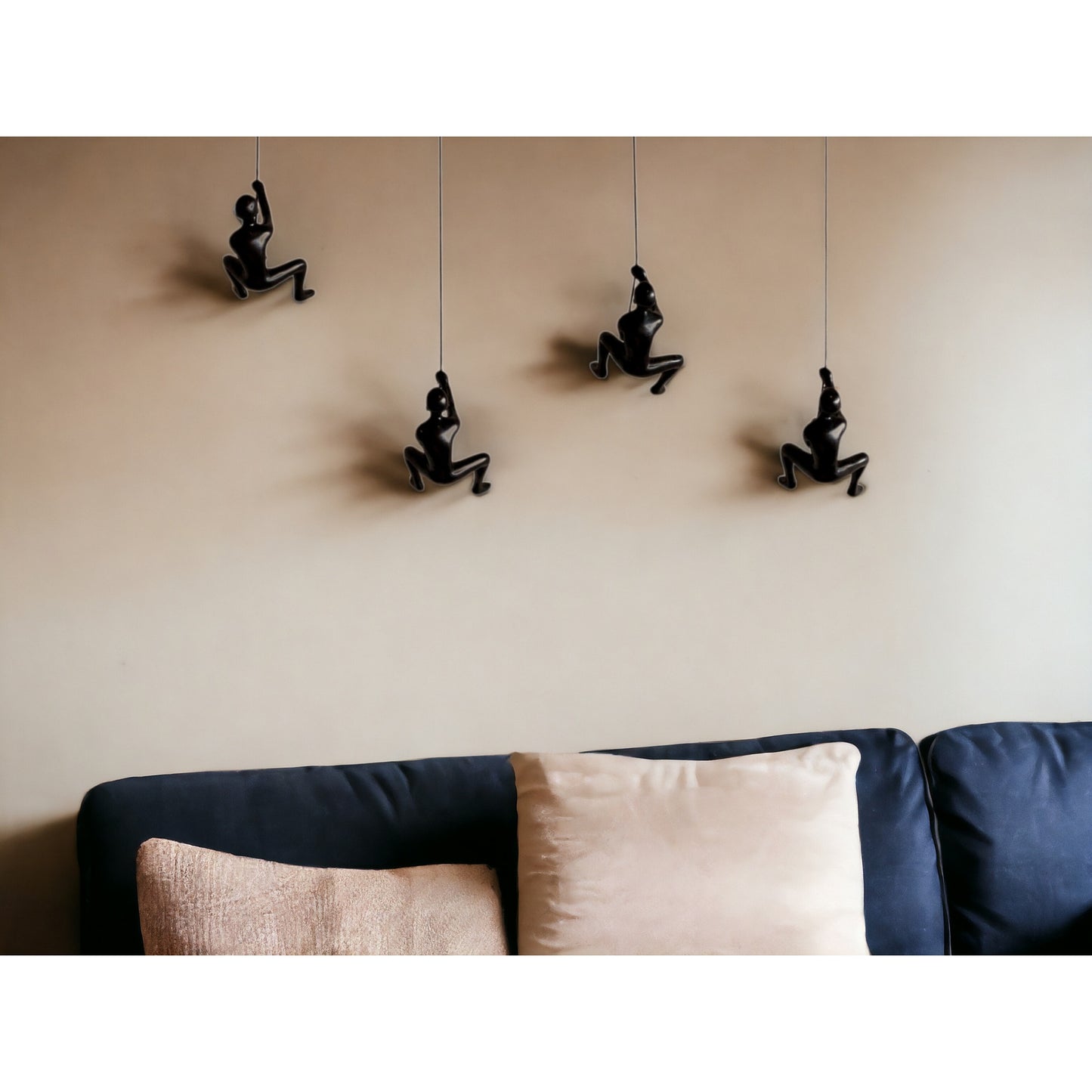 Set of Four Black Resin Climbing Man Wall Sculptures